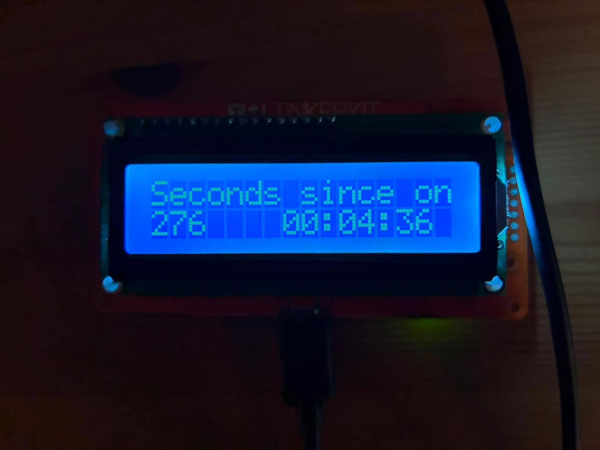 The TinkerKit LCD Module actually displaying the counter — 276 seconds since power-on, no LED wired up yet