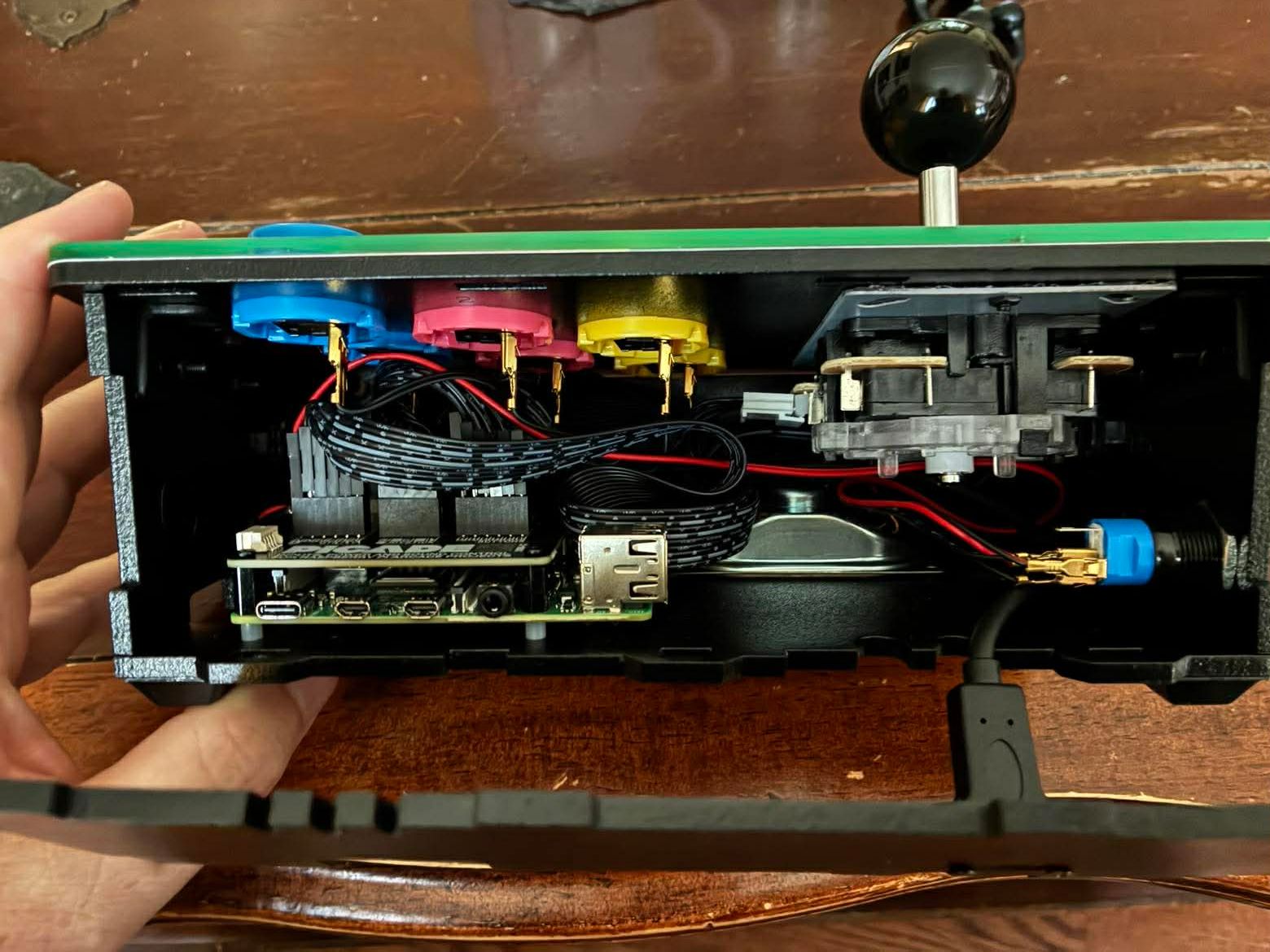 I opened up the case to check the internal wiring — the Raspberry Pi and button connectors are all packed in neatly