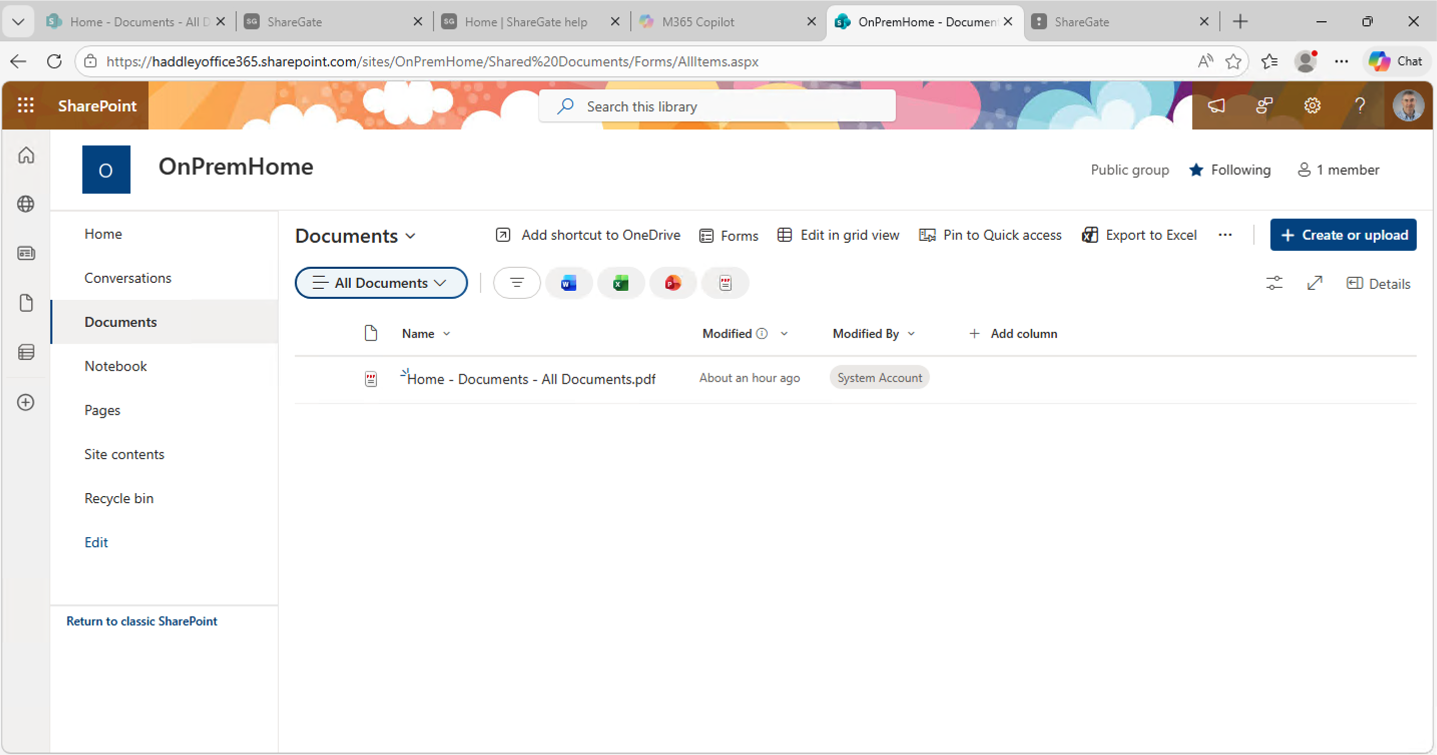 The OnPremHome Documents library in SharePoint Online showed the migrated PDF had arrived successfully